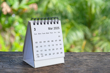 Wall Mural - March 2025 white table calendar with outdoor background. Calendar concept