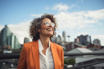 Wall Mural - Portrait of a happy woman in her 50s dressed in a stylish blazer in front of vibrant city skyline