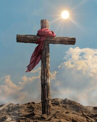 Wall Mural - Embraced by love and sacrifice, a wooden cross stands in the desert with red cloth over it.