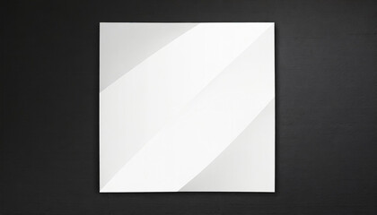 Wall Mural - white paper with folds on a black wall