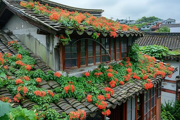 Wall Mural - The roof of the small house is covered with white tiles, and there's an overgrown vine on one side that has red flowers hanging down from it.