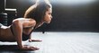 © peopleimages.com - Push up, fitness and woman for strength, arms and workout on gym floor for health. Muscle, bodybuilding and strong female person for exercise, training and routine for sports and cardio goals