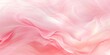 © mikeosphoto - Soft flowing pink silk fabric background with gentle, wavy layers and smooth folds, creating an elegant and delicate texture. Perfect for design projects and backgrounds