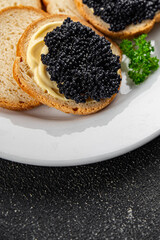 Wall Mural - caviar lumpfish black caviar fresh seafood appetizer meal food snack on the table copy space food background