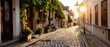 © Purichaya - Cobblestone street with charming boutiques, European village, picturesque scene