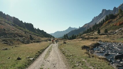 Wall Mural - Group of tourist hiking on autumn wilderness in Claree valley among the French Alps