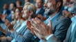 © Lens Legacy - A lively image of individuals in formal attire clapping their hands during a formal gathering, capturing the spirit of celebration, unity, and shared appreciation in the moment.