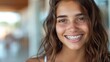 © Lens Legacy - A captivating close-up of a girl with brown hair and freckles, showcasing her bright smile with braces, emitting a sense of joy and warmth in a natural setting.
