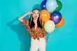 © deagreez - Photo of charming positive woman wear orange shirt holding balloons showing v-sign cover eye isolated turquoise color background