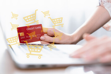 Elegant customer hold credit card with hologram interface choose online platform. Smart consumer typing laptop while open e-commerce application use cashless technology shopping inventory. Cybercash.