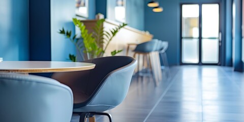 Canvas Print - A blue room with a table and chairs