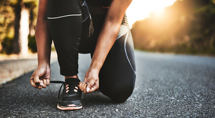 Sticker - Person, closeup and fitness with tying shoes in street for running, morning workout or outdoor exercise. Hands of woman, runner or tie laces in preparation or getting ready for cardio on road