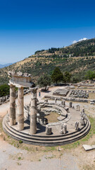 Wall Mural - Aerial bird's eye view photo taken by drone of archaeological site of ancient Delphi, site of temple of Apollo and the Oracle, Voiotia, Greece