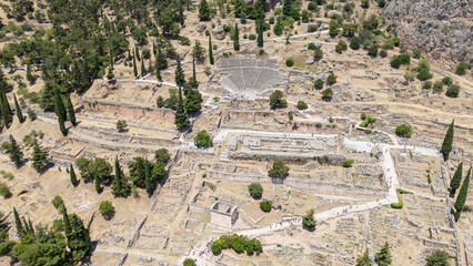 Aerial bird's eye view photo taken by drone of archaeological site of ancient Delphi, site of temple of Apollo and the Oracle, Voiotia, Greece