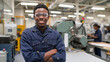 © Anna - An African American man wearing safety goggles working on a machine in a factory