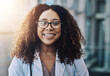 © peopleimages.com - Portrait, doctor and happy woman in hospital for healthcare career, job and medicine in Brazil. Face, smile and medical professional in glasses, employee and confident worker in clinic for service