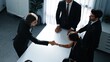 © InfiniteFlow - Top view of professional business team shaking hand and clapping hands to celebrate young businesswoman getting promotion. Diverse business people congratulate for successful project. Directorate.