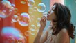© Ева Поликарпова - A woman standing in front of a wall, blowing bubbles