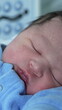© Marco - Peaceful sleep of a newborn in the hospital, highlighting the innocence and serenity of a new life in a calm and nurturing environment, vertical video