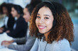 © peopleimages.com - Black woman, portrait and smile in call center with headset for customer service, crm and help or consulting. Agent, headphones and talk with clients for question, information or technical support