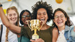 © LotusBlanc - Multiracial Team Celebrating with Golden Trophy in Office After Winning Competition, DEI, DEIB at Work, Racial Diversity and Inclusion, Business Achievement.