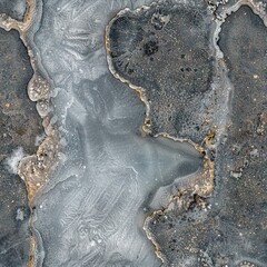 Wall Mural -   An aerial photo captures a frozen lake surrounded by rocky cliffs