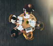 © peopleimages.com - Top view, business people and brainstorming with paperwork, charts and cooperation with reports. Group, employees and teamwork with collaboration, development for ideas and support with proposal