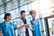 © peopleimages.com - Healthcare, conversation and doctor with nurses, medicine and talking together at hospital. Medical, collaboration and smartphone with clinic, result and specialist for diagnosis and insurance