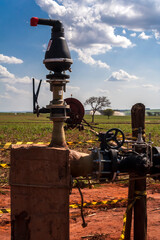 Wall Mural - valve and equipment of a vinasse irrigation system in a sugar cane field in Brazil