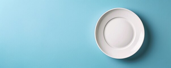 Poster - White plate on blue background, minimalist design concept