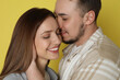 © New Africa - Happy couple on yellow background. Strong relationship