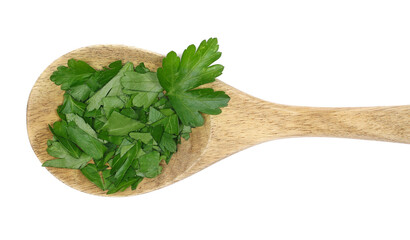 Wall Mural - Chopped fresh green celery leaves in wooden spoon, isolated on white, top view