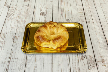 Wall Mural - A croissant with horns, hand-made daily by the bakers, has a classic flavour, a sweet aroma and a flaky texture