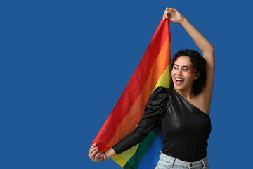 Sticker - Happy African-American woman with rainbow flag on blue background. LGBT concept