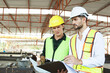 © DG PhotoStock - Construction engineers team working - discussing together.