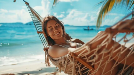 Wall Mural - Beautiful woman relaxing in a hammock at the beach