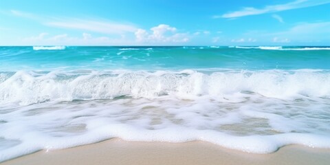 Poster - The ocean is calm and the water is blue. The waves are small and the beach is sandy