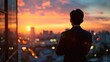 © vefimov - A man in a suit is standing on a balcony looking out at the city skyline. The sun is setting, casting a warm glow over the buildings. The man is lost in thought