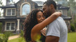 © btiger - Joyful African American Couple Hugging in Front of Their New Modern Home Surrounded by Trees and Grass