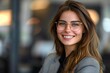 © Yuliia - Young businesswoman with a laughing expression, some wearing eyeglasses, at the hiring interview in the office.