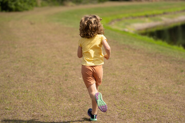 Sticker - Sporty young child running jogging and training outdoor. Run and healthy sport for children. Child running on street kids fitness. Running training outdoor, morning jogging. Run exercising.