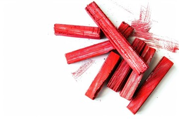 Wall Mural - A close-up shot of a pile of fresh rhubarb sticks on a white surface, ideal for use in food and drink photography