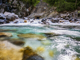 Wall Mural - Waterfall and dam in the Julian Prealps. Crosis, pearl of Tarcento. Nature and engineering.