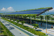 © forenna - innovative image of a modern bus station powered by solar panels integrated into the roof design. The clean and futuristic station features lush greenery around the perimeter, show