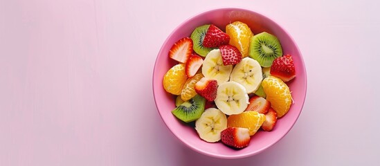 Wall Mural - Fruit Salad Presentation in a Vibrant Pink Bowl on a Clean White Background: Banana, Orange, Kiwi, and Strawberry Slices. Promoting Healthy Eating.