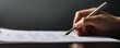 © chayantorn - Business hand holding a pen over a contract against dark background, signing document