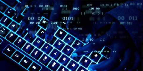 Closeup of hands using a keyboard