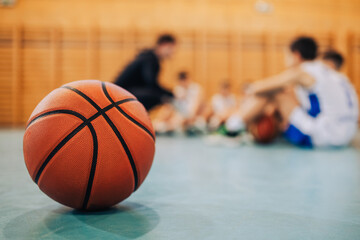 Wall Mural - Close-up of a basketball on a gym floor