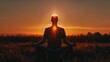 © Taisiia - A man meditating at sunset, opening his chakras, and practicing in the lotus position
