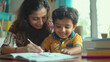 © Neha - Indian mother teaching to her son at home
